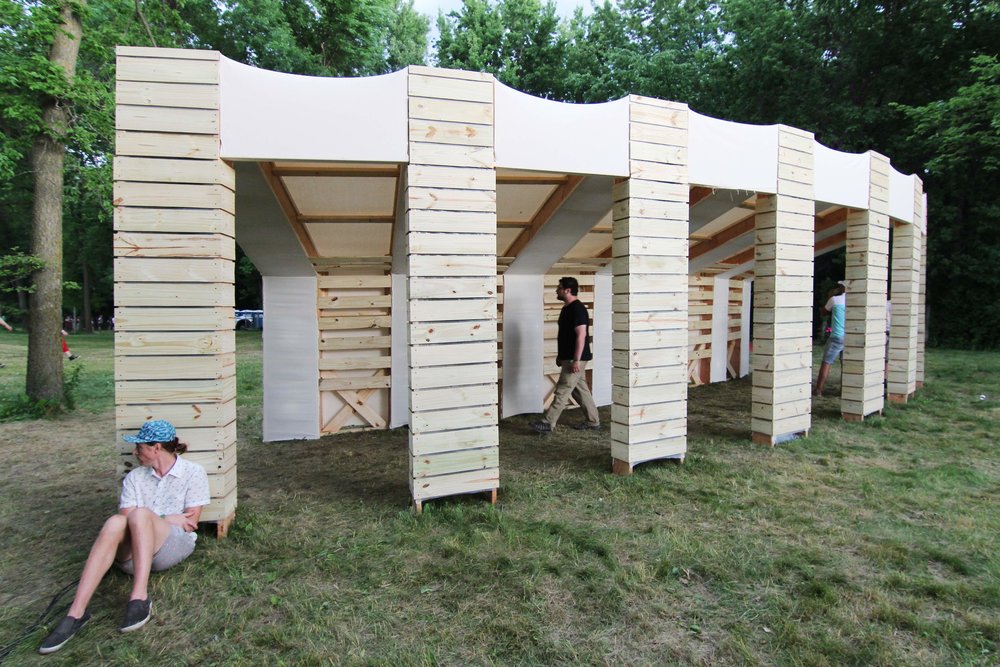 Wooden installation with walkable covered moment