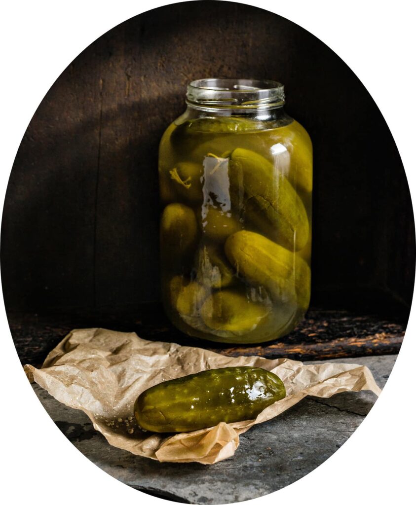Pickle jar and pickle on butcher paper