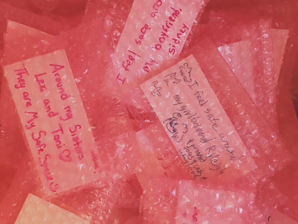 secrets written on paper in pink bubblewrap